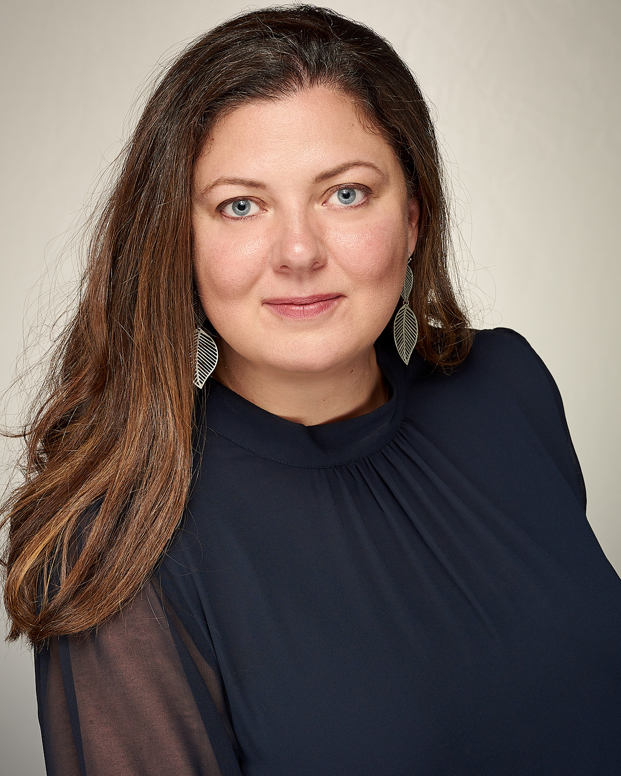 A woman CEO in a headshot in Los Angeles made by The Light Committee