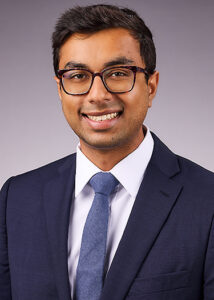 A man posing for a medical residency headshot wearing a suit in Los Angeles