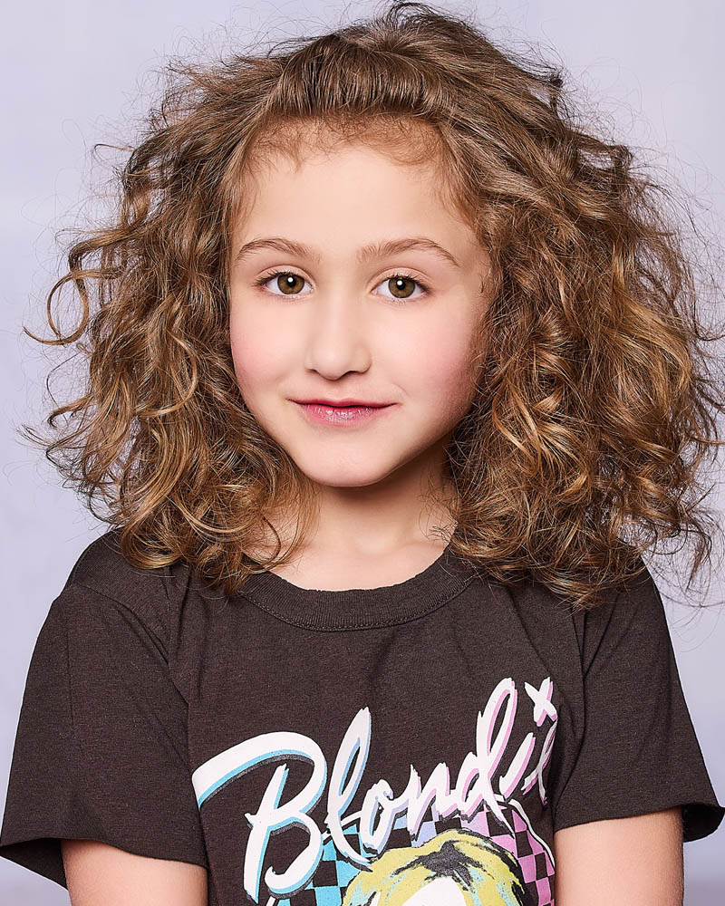 A young girls headshot to submit for kids modeling agency