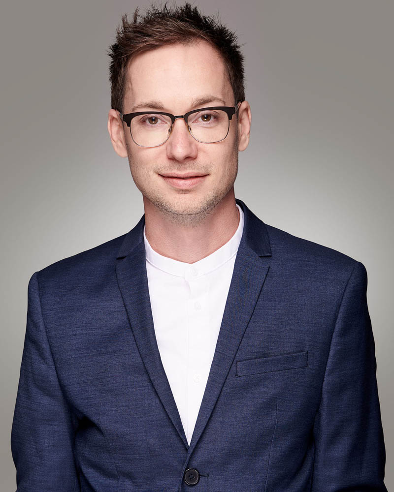 corporate headshot in a studio with a light background near Burbank, CA