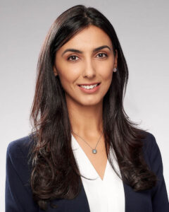 A corporate headshot of a woman in a suit in studio near Arcadia