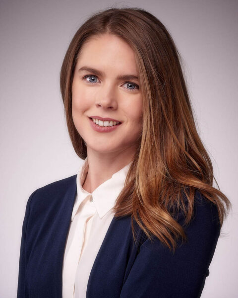 A professional headshot of a woman entertainment executive in a suit in studio near Los Angeles