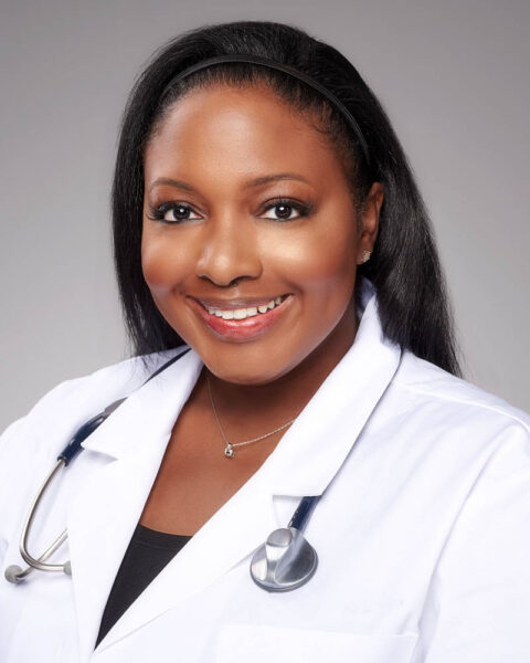 A doctor headshot of a black woman in a suit in studio near Los Angeles