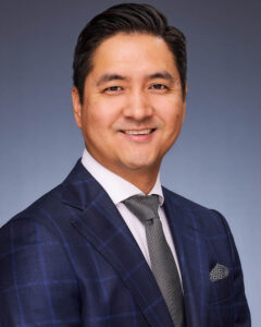 corporate headshot of an Asian man in a suit and tie in Pasadena