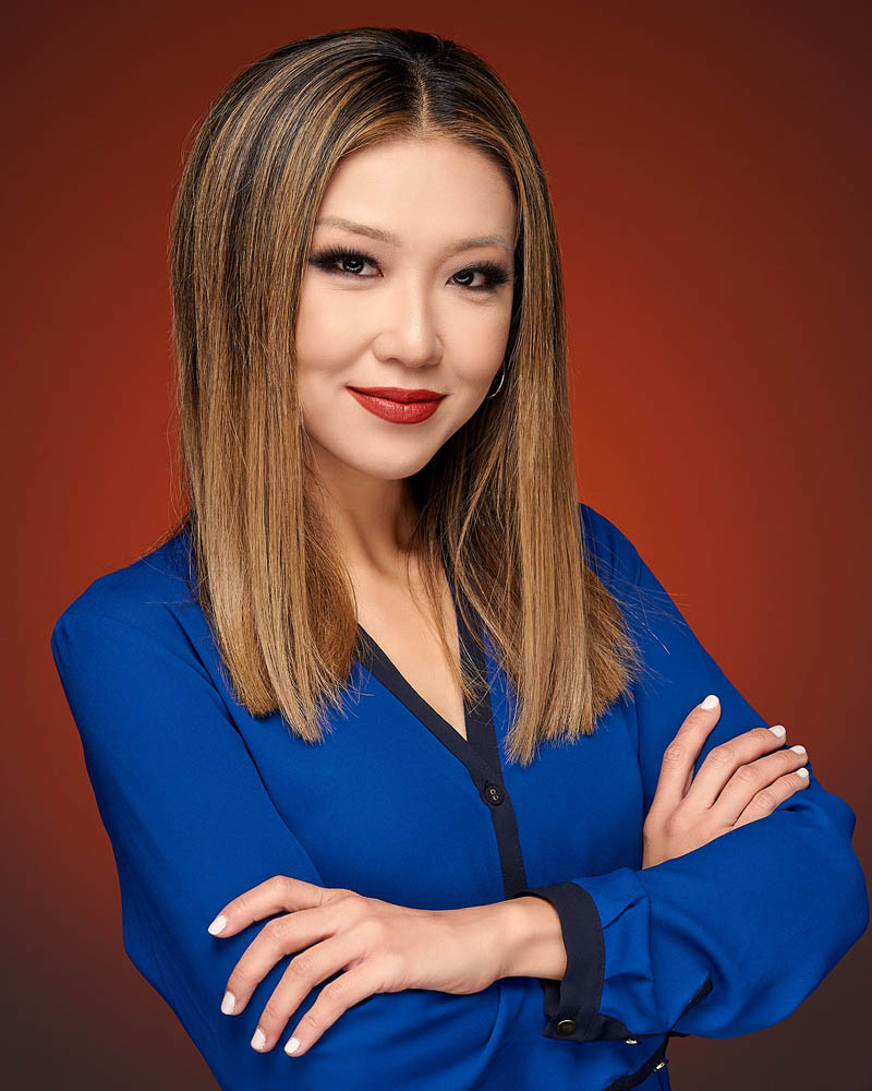 A tech executive headshot of a woman in a suit in studio near Los Angeles
