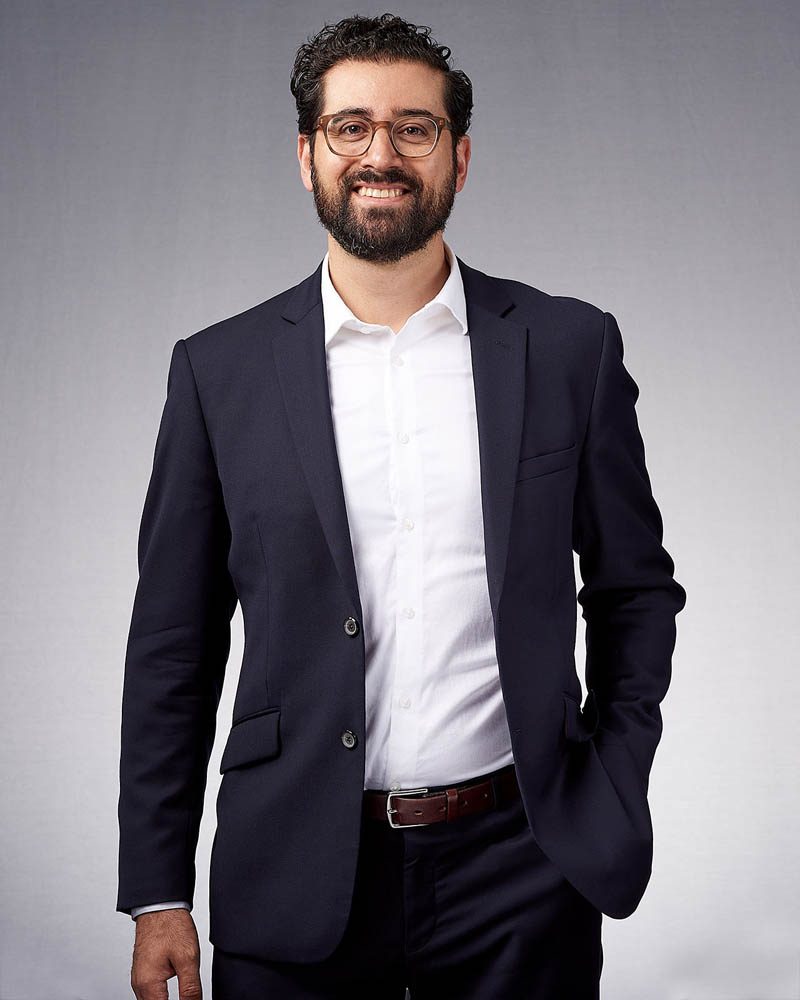 corporate headshot in a studio with a light gray background near West Hollyood, CA