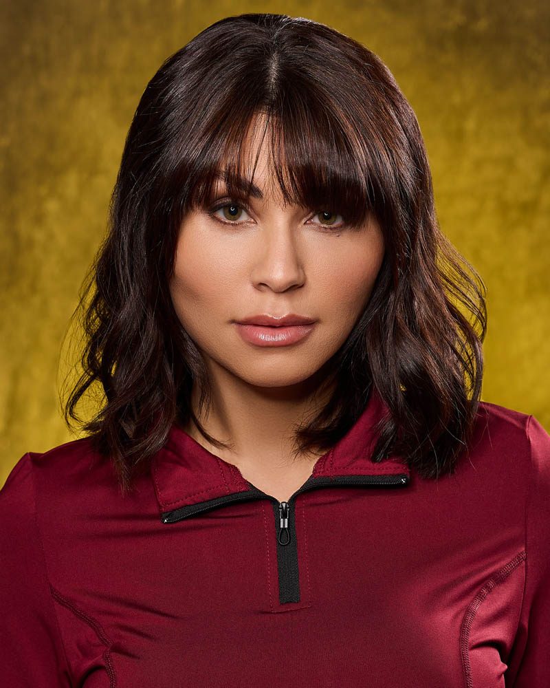 A theatrical actor headshot of a Latina woman in a studio near Burbank, CA