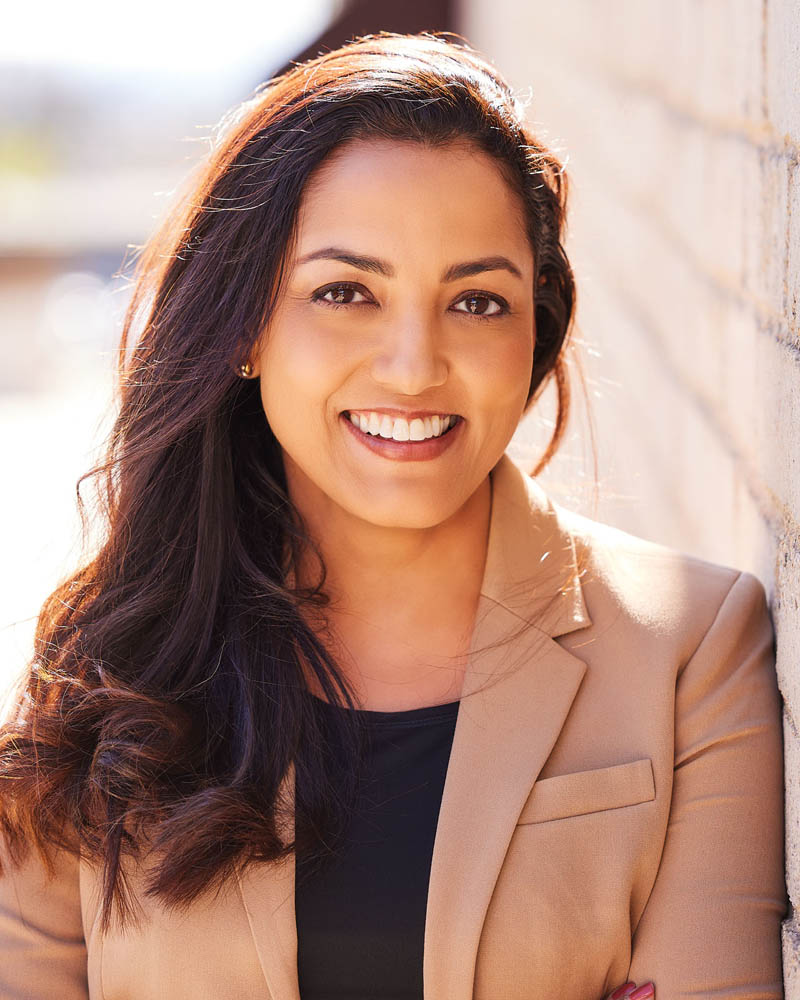 A professional headshot of a business woman in a suit in studio near Los Angeles