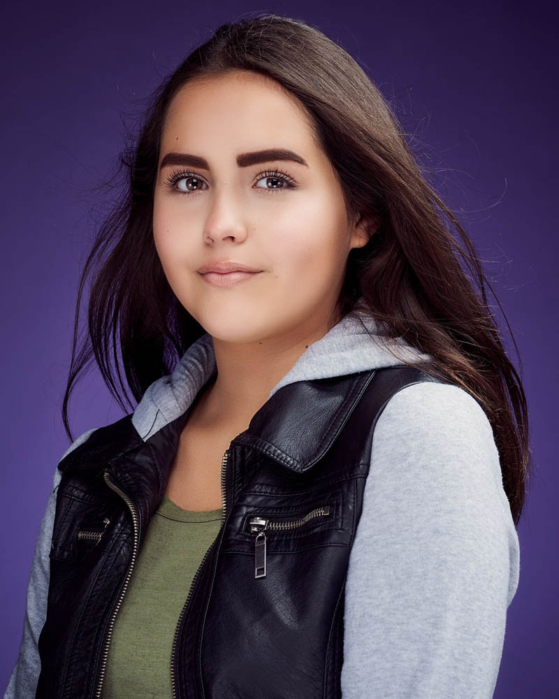 teen girl acting headshot in a studio near Encino with a purple background