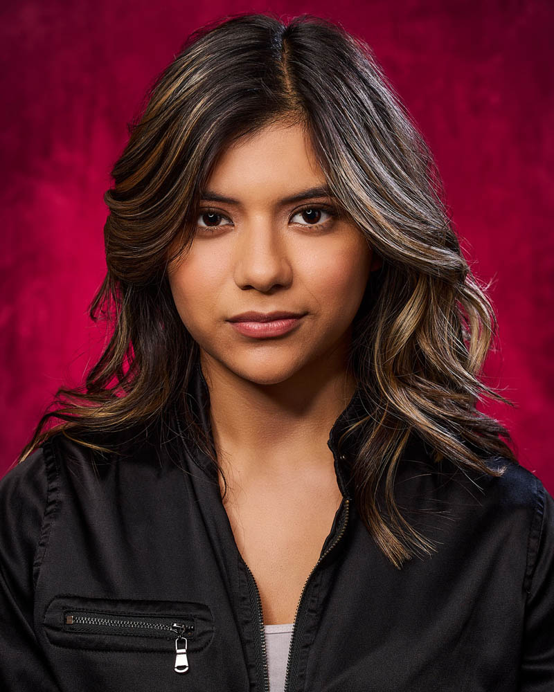 A theatrical actor headshot of a Latina woman in a studio near East Los Angeles