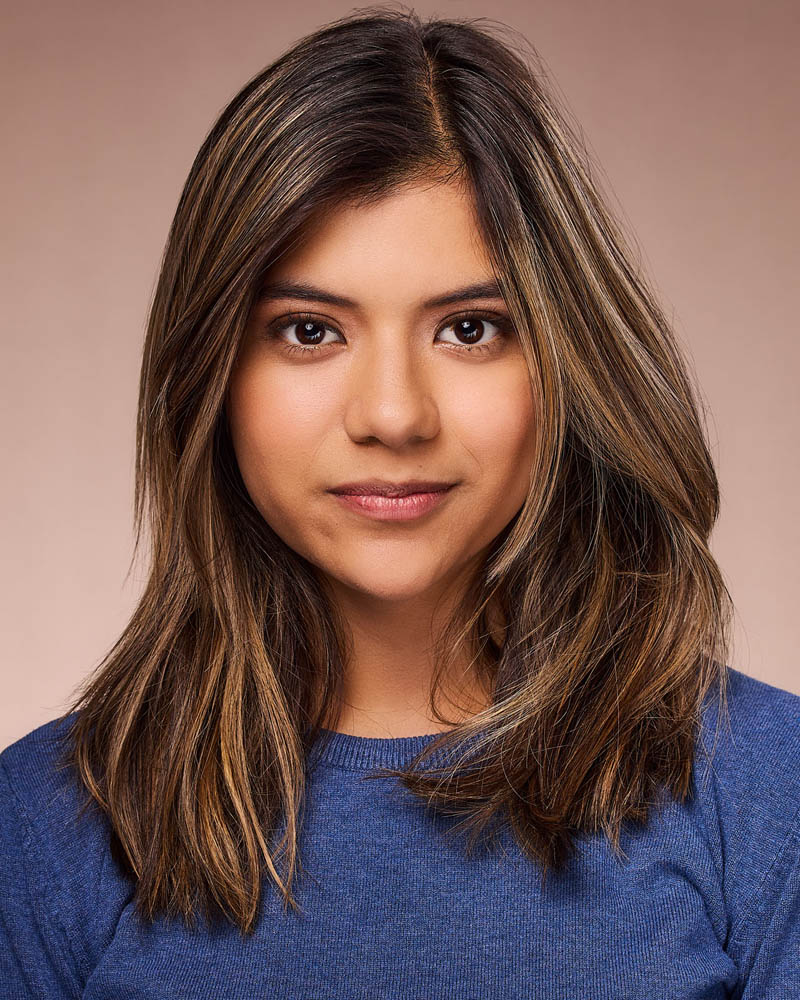 A commercial actor headshot of a Hispanic woman in a studio near Burbank, CA