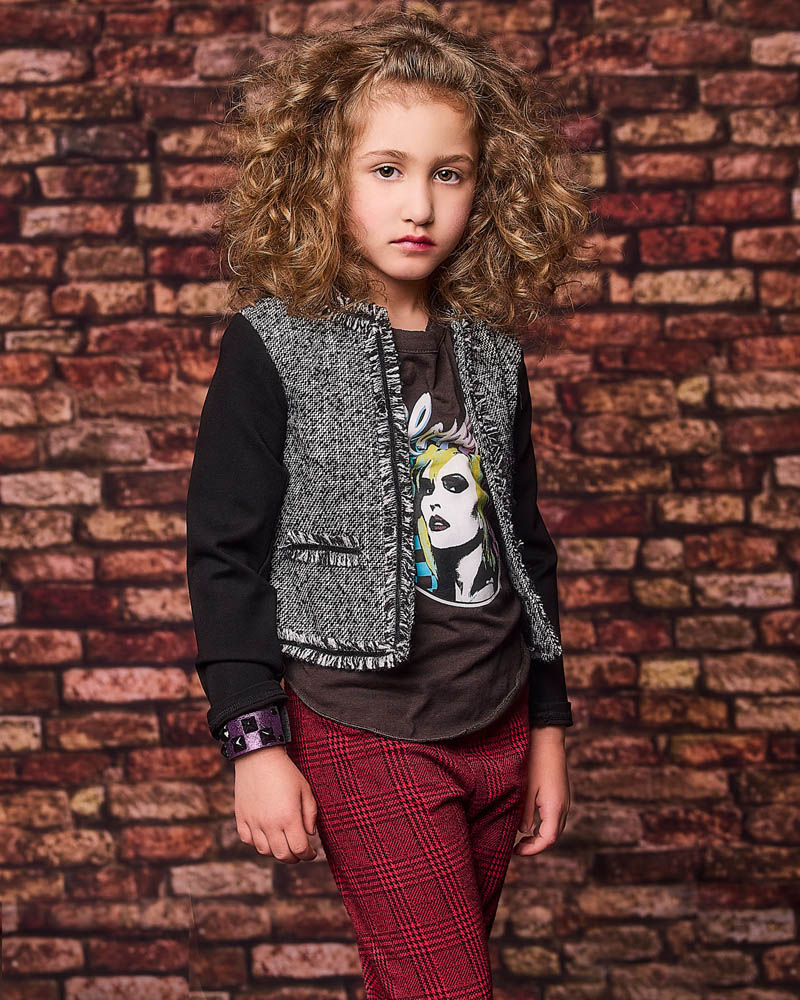 young girl acting headshot in a studio near Pasadena with a brick wall background