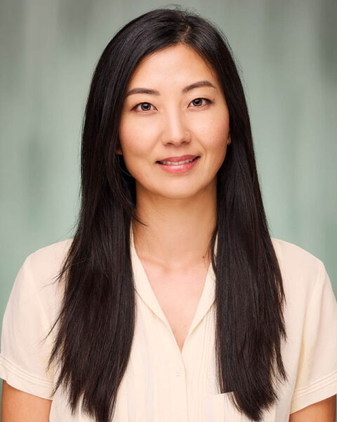 A professional headshot of an Asian woman in a suit for Psychology Today in studio near Pasadena