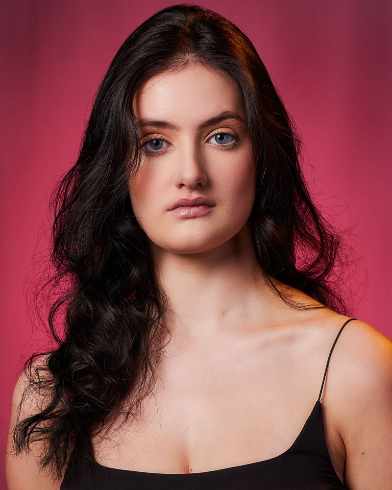 A sultry commercial actor headshot of a woman in a studio near Los Angeles