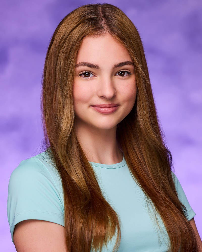 teen girl acting headshot in a studio near Hollywood with a purple background