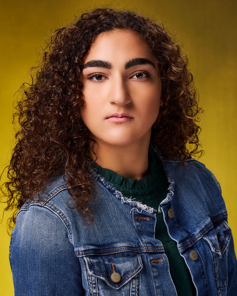 teen girl theatrical acting headshot in a studio near Pasadena with a yellow background