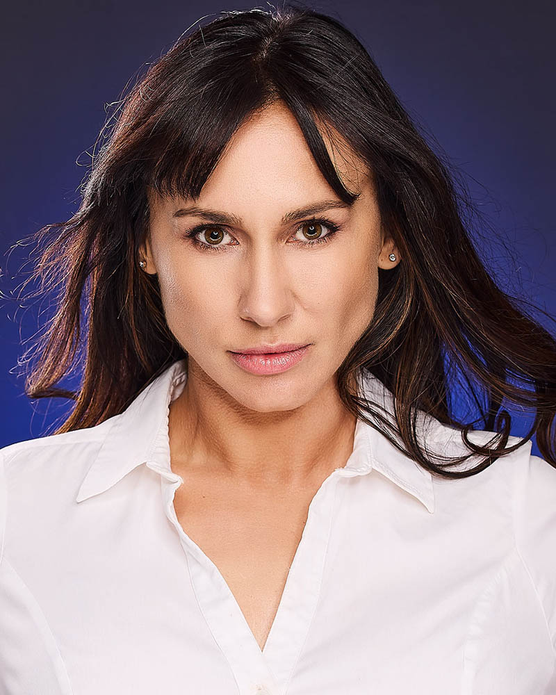 theatrical headshot of a woman with hair blowing back in a studio in Los Angeles