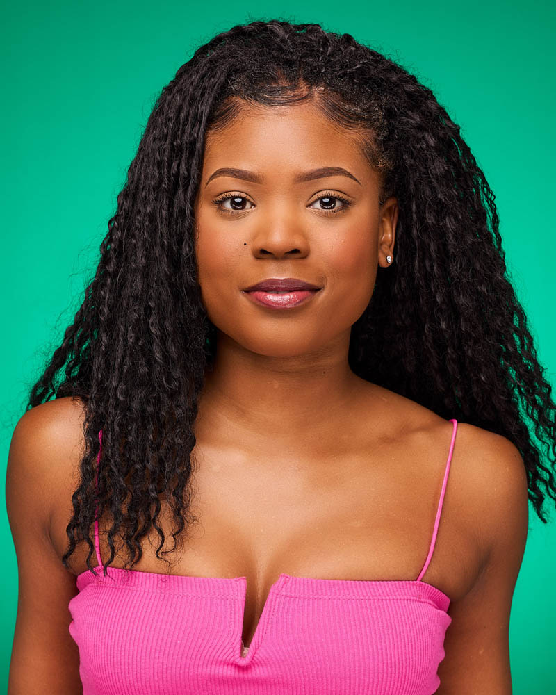 A colorful commercial actor headshot of a black woman in a studio near Los Angeles