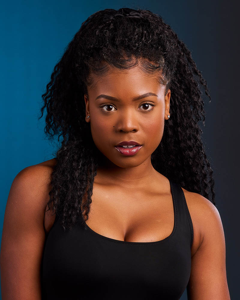 A colorful theatrical actor headshot of a black woman in a studio near Pasadena