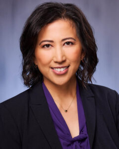 A professional headshot of a woman in a suit in studio in Glendale, CA