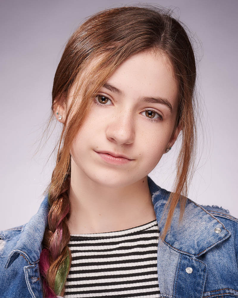 young girl acting headshot in a studio in Los Angeles with a light background